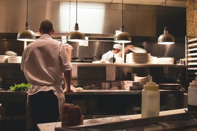 chef-standing-in-restaurant-kitchen.jpg